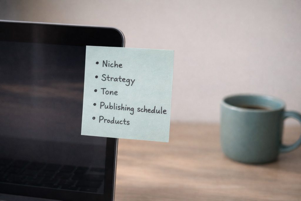 Sticky note on a laptop screen with key ideas written on it